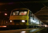 The Highland Sleeper calls at Preston on 19 March 2010 with DBS 90036 providing the power. Having changed drivers a few minutes earlier the new man now looks back along the train for the signal to depart just before 0100hrs on the next leg of the journey to Edinburgh.<br>
<br><br>[John McIntyre 19/03/2010]