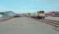 Kilmarnock Goods Yard in 1989. Today this is the site of the Hunslet Barclay works (now owned by Brush and renamed Brush Barclay). The yard was given over to trains needing attention at the nearby works - on this occaision a number of 'Pacers'. What I think are two of Barclay's fleet of 20s can be seen in the distance. The view looks north-west and the station is on the right.<br><br>[Ewan Crawford //1989]