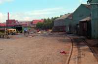 Looking north from West Langlands Street away from the (then) Hunslet Barclay Caledonia Works - this view shows the link between British Rail and the works taken out of use when the works re-located. The Johnnie Walker bottling plant can be seen on the horizon and a 'Pacer' can (just) be seen in the former goods yard. View from 1989.<br><br>[Ewan Crawford //1989]