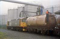 Turning on a really big tap at the James Watt Dock. 26040 at the United Molasses depot in 1989. That's a TTA to the right and a TTB to the left.<br><br>[Ewan Crawford 08/09/1989]