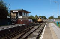 Northbound 153321 at Penyffordd passing the signalbox.<br><br>[Ewan Crawford 15/09/2006]