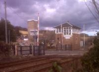 Haydon Bridge station in March 2010. The new barriers don't look as nice as the old gates [see image 9392] but the signal box is still in fine form; and manned on a Sunday.<br><br>[Ken Strachan 14/03/2010]