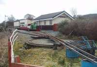 A view of the Craignure turntable with its fan of 260mm tracks. Isle of Mull Railway DH B-B <I>Frances</I> is on a works train standing in the station behind.  <br><br>[Mark Bartlett 23/03/2010]