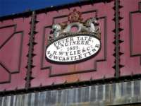 Makers plate on water tower alongside Haltwhistle station, Northumberland, in March 2010.<br><br>[John Steven 07/03/2010]