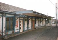 The Caledonian Railway station building on the Glasgow-bound side at Wishaw (formerly Wishaw Central) had obviously seen better days when this photograph was taken in August 1997.  It managed to survive until 2000 and was replaced in the brushed aluminium and glass look, and is still staffed.<br><br>[David Panton /08/1997]