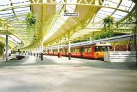 A Class 303 awaits custom at the then newly restored Wemyss Bay station in August 1994<br><br>[David Panton /08/1994]