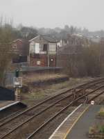 Boarded up and inaccessible former Whitchurch signal box on west side of line north of station, with platform end south to north cross-over taken out of use by removal of southbound diamond crossing and plain railing.<br><br>[David Pesterfield 23/03/2010]