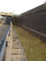 View looking towards the buffer stops along the fenced off former northbound bay platform and trackbed at Whitchurch Station. <br><br>[David Pesterfield 23/03/2010]