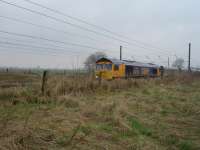 66712 Peterborough Power Signalbox on southbound First GBRF loaded Tyne Dock to Drax Power Station working passes Shipton north of York at 10.33 just prior to northbound empty working passing<br><br>[David Pesterfield 25/03/2010]