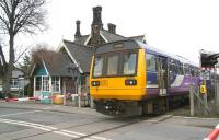 The 1038 ex-Middlesbrough about to clear the level crossing at Ruswarp on 23 March 2010 prior to making the penultimate stop on its one and a half hour journey to Whitby.  <br><br>[John Furnevel 23/03/2010]