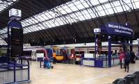 View over the ticket barriers towards the platforms at Glasgow Queen Street on 27 March 2010.<br><br>[John Steven 27/03/2010]