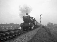 B16 no 61418 with the <i>Durham Rail Tour</i> passing Norton South distant signal on the straight section from North Shore Junction approaching Norton South Junction soon after leaving Stockton station on 13 October 1962. The signal box in the background is Stockton Bank, which controlled traffic using Stockton yard. The B16 had taken over the train from V3 no 67636 at West Auckland Colliery earlier that day [see image 25127].<br><br>[K A Gray 13/10/1962]