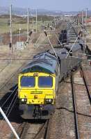 Freightliner 66953 crosses into Falkland Yard, Ayr, with empties on 19 March, probably destined for Chalmerston.<br>
<br><br>[Bill Roberton 19/03/2010]