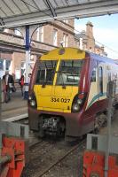 An arrival from Glasgow Central, formed by 334 027, stands at the buffers on platform 1 at Ayr Station on 19 March 2010.<br>
<br><br>[Bill Roberton 19/03/2010]