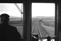 View through the driver's cab of the 07.54 Edinburgh-Galashiels via Peebles train shortly after leaving Leadburn on the last day of service, Saturday 3rd February 1962.<br><br>[Frank Spaven Collection (Courtesy David Spaven) 03/02/1962]