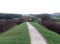 On the 80th anniversary of its closure to passengers (310330) this is the view along the old GKER railway embankment east of Garstang towards the WCML. Just beyond the gate, part of the embankment has been removed for a flood basin scheme but beyond that the footpath joins it again as far as the cutting near the WCML. [See image 18535].<br><br>[Mark Bartlett 31/03/2010]