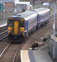 156 449 approaches Busby with a service for Glasgow Central on 17 March 2010. The signal in the background protects the single track to East Kilbride.<br><br>[David Panton 17/03/2010]