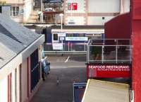 <I>Welcome to Oban</I> is the gaelic greeting for disembarking ferry passengers as they make their way from the quayside to Oban station. This more unusual view of Oban station, and the late afternoon train to Glasgow (Sprinter 156493), was taken from the top deck of Calmac's DSMV <I>Isle of Mull,</I> about to set sail for Craignure. <br><br>[Mark Bartlett 22/03/2010]