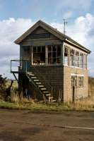 The derelict signalbox at East Winch on the Kings Lynn - Dereham line seen on 20th November 1977. Last active in 1968, the remains survived to be moved recently for restoration at Thuxton station on the Mid Norfolk railway.<br><br>[Mark Dufton 20/11/1977]