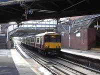 318 260 pulls into Dalmarnock with a Dalmuir service on 17 March 2010.<br><br>[David Panton 17/03/2010]