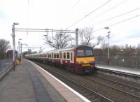 An eastbound 6-car 320 at Carntyne on 17 March 2010 with a destination display showing three parallel lines.<br><br>[David Panton 17/03/2010]