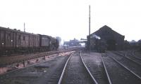 A southbound freight about to run through Beattock station in 1965 passes BR standard class 4 2-6-0 no 76090 standing outside Beattock shed.<br><br>[Robin Barbour collection (Courtesy Bruce McCartney) //1964]