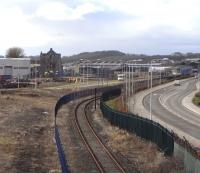 Is this Scotland's least-used working branch? Looking west along the Rosyth Dockyard line towards the docks on 27 March 2010. In the background is the Babcock Engineering's shed [see image 22278] and on the left is Rosyth Castle. It's hard to believe but until the Royal Dockyard was built round it in Edwardian times this was on a tidal island off a shore with no signs of habitation: the settlement of Rosyth simply didn't exist until built from scratch as a 'garden city'.<br>
<br><br>[David Panton 27/03/2010]