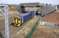 Westbound 158 782 passes under the new 'Carricknowe Viaduct' carrying the Edinburgh tram route on 7 April 2010.  Progress is also being made on the related earthworks.<br><br>[Bill Roberton 07/04/2010]