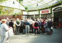 It's August 1994 and the occasion is a Historic Scotland excursion from Glasgow Central to Rothesay Castle by train (reserved coach on a Class 303) and ferry. On the way through Wemyss Bay station our guide gave a brief talk on the the building and it's then recent restoration. By the look of things he either hadn't yet got everybody's attention or had already lost it. <br>
<br><br>[David Panton /08/1994]