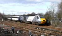 Power car 43 318 leads an East Coast service round the curve at Central Junction on its approach to Inverkeithing station on Good Friday, 2 April.  This is the 1450 from Aberdeen to London King's Cross, 1E24 (I only know that number because East Coast helpfully print them in their public timetables).  This was photographed over a 6ft high mesh fence, so I wouldn't recommend this location unless you've got the height.<br>
<br><br>[David Panton 02/04/2010]