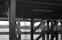 A class 114 DMU runs onto the pier at New Holland to connect <br>
with the Hull ferry. Taken through the timbers of the pier from a ferry on Friday 21stAugust 1970.<br>
<br><br>[Bill Jamieson 21/08/1970]