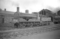 Caley <I>Jumbo</I> no 57284, complete with stovepipe chimney, stands on Hurlford shed in July 1959. The locomotive spent much of its life at Hurlford, being eventually withdrawn from here in October 1962. <br><br>[Robin Barbour Collection (Courtesy Bruce McCartney) 28/07/1959]