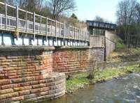 Looking back towards Galashiels station from the north side of the Gala Water in April 2010 showing the modified former railway bridge, now a walkway. The site of Kilnknowe Junction is just off picture to the left. The plate-girder bridge crossing the formation on the south side of the river carries Plumtreehall Brae. <br><br>[John Furnevel 11/04/2010]