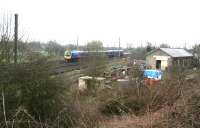 The 1135 Manchester Airport - Middlesbrough heads past the site of Alne station, 10 miles north of York on the ECML, in March 2010. Opened by the GNoER in 1841 the station also became the western end of the independent Easingwold Railway 50 years later. This resulted in the addition of a bay platform on the east side of the line and a crossover to the goods yard on the west side. Alne station closed to passengers in 1958 and has since been demolished, although  the former goods yard and shed, now in private ownership, are still in use.<br><br>[John Furnevel 25/03/2010]