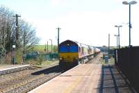 A pair of class 66 locomotives, led by 66138, with westbound oil tanks through Cholsey in April 2010. The tanks are destined for the Westerleigh oil depot near Yate.<br><br>[Peter Todd 08/04/2010]