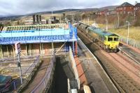 Freightliner 66508 heads south with a coal train on 5 March 2010 past ongoing restoration work at Sanquhar station.<br><br>[Peter Rushton 05/03/2010]