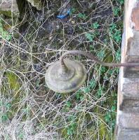 The former Milton Junction was where the East Fife line left the main line just south of Leuchars station.The box which controlled it was called Leuchars South.The East Fife line was single so a tablet was needed, therefore a tablet platform was located alongside the box. This odd remnant is the lamp which illuminated the platform, still in situ 41 years after the closure of the junction and box. Photographed in April 2010 by sticking my head over the parapet of the overbridge on which it is mounted! <br>
<br><br>[David Panton 14/04/2010]