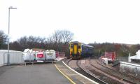 The 14.34 arrival from the north runs into Girvan station on 20 April via the new bridge.<br><br>[Colin Miller 20/04/2010]