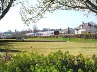 Seaside springtime scene as a Northern 156 Sprinter heads for Barrow, and then Carlisle, passing some of the promenade leisure facilities at Grange-over-Sands. <br><br>[Mark Bartlett 17/04/2010]