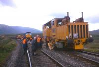 Guests of BR viewing the reinstatement of double track just south of Dalwhinnie in 1976. At the time, following a major surge of heavy commodity rail freight to and from the Invergordon aluminium smelter, coupled with North Sea oil-related pipe traffic, rail held a market share of around a half of all road and rail tonnage over Druimuachdar.<br><br>[Frank Spaven Collection (Courtesy David Spaven) //1976]