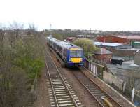 170 412 approaches Cowdenbeath with an Outer Circle working on 14<br>
April.It is crossing over the High Street. The Leisure Centre on the right of the picture occupies the site of No 7 pit, right in the town centre. Coal was indeed king.<br>
<br><br>[David Panton 14/04/2010]