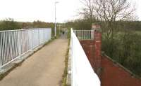 The bridge that once carried the mineral line south over what is now the A89 towards Uphall oil works. The original bridge abutments still stand, but now support a pedestrian walkway/cycleway, seen here on a drizzly 23 April 2010 looking towards Uphall. Much has changed in the 45 years since the original photograph was taken [see image 28599].<br><br>[John Furnevel 23/04/2010]