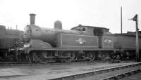 G5 0-4-4T no 67281 standing in the works yard at Darlington in 1959 behind 62730 [see image 28386]. This was possibly the last surviving example of a G5 and had been withdrawn by BR the previous year.<br><br>[K A Gray //1959]