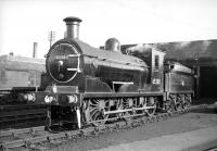 J36 no 65288 on Dunfermline shed around 1966. No 65288 had been adopted by Dunfermline High School Railway Society and repainted by society members while still in BR service. At this stage it was fitted with 1 small and 1 standard size buffer at the front end.<br><br>[Robin Barbour Collection (Courtesy Bruce McCartney) //]