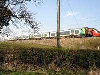 London Midland Siemens built Desiro EMU 350112 on London Euston to Liverpool Lime Street stopping service being passed by northbound Pendolino whilst held at signals south of Winsford Station <br><br>[David Pesterfield 22/04/2010]