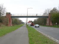 View west along the A89 on 23 April 2010 towards the traffic lights at Station Road crossroads. The old bridge that once carried trainloads of shale to Uphall oil works [see image 28599] is now part of a walking/cycling route linking Uphall village and Uphall Station to the south.<br>
<br><br>[John Furnevel 23/04/2010]