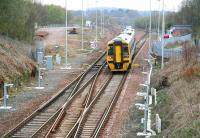 An eastbound empty stock movement runs through Polmont Junction on 23 April 2010. The area on the left was once occupied by the shed and sidings of Polmont MPD, closed in May 1964, demolished in 1966.<br><br>[John Furnevel 23/04/2010]