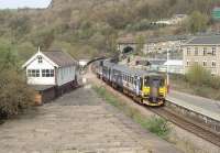 A Huddersfield to Leeds via Bradford working leaves Halifax and is just about to enter Beacon Hill tunnel. 155343 is passing the still operational signalbox, which once also controlled the junction with the GN&LY Jt line to Bradford via the <I>Queensbury Triangle</I>. That steeply graded line closed to passengers in 1955, leaving only this direct route that is still busy today. <br><br>[Mark Bartlett 24/04/2010]