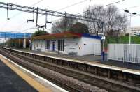 Opened in 1953, Drumry is in the select band of stations <br>
that joined the network between the 1930s and the station opening <br>
'mini-boom' of the 1980s.  The unusual architecture reflects the <br>
period.  Neighbouring Singer alone has a building in the same style but it is long out of rail use.  Note that while the rest of the station is in the 'Scotland's Railway' colour scheme the canopy remains in SPT maroon.  Health and safety concerns, perhaps.  <br><br>[David Panton 24/04/2010]