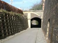 The southern approach to Ladhope tunnel, half a mile north of Galashiels station, seen here on 11 April 2010. The photograph shows the modifications that were carried out around the south portal of the tunnel in order to accommodate road improvements following closure of the line [see image 28615].<br><br>[John Furnevel 11/04/2010]